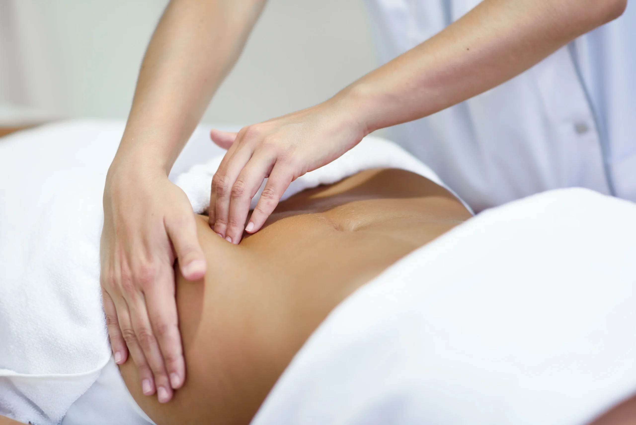 woman receiving belly massage spa salon scaled